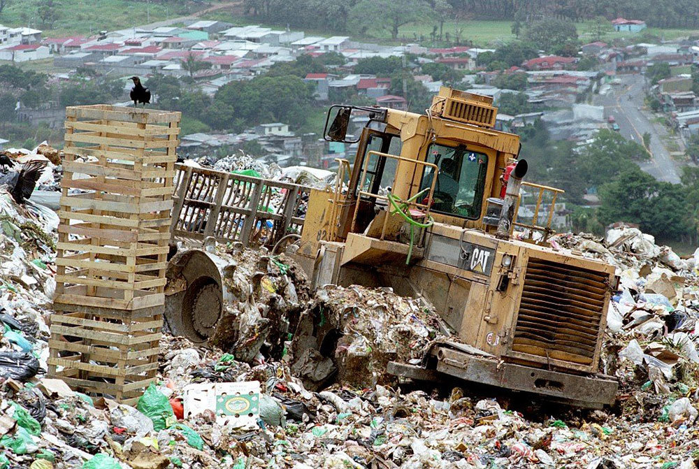 Digger at Landfill Site